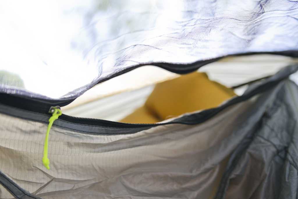 ...as well as a small zippered opening at the head end for easy access from inside the hammock